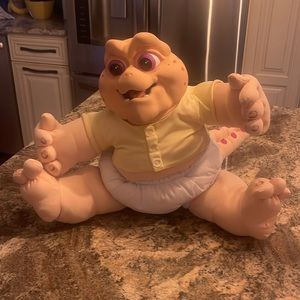 Talking baby Sinclair stuffed toy. Hasbro/Disney in very good condition.